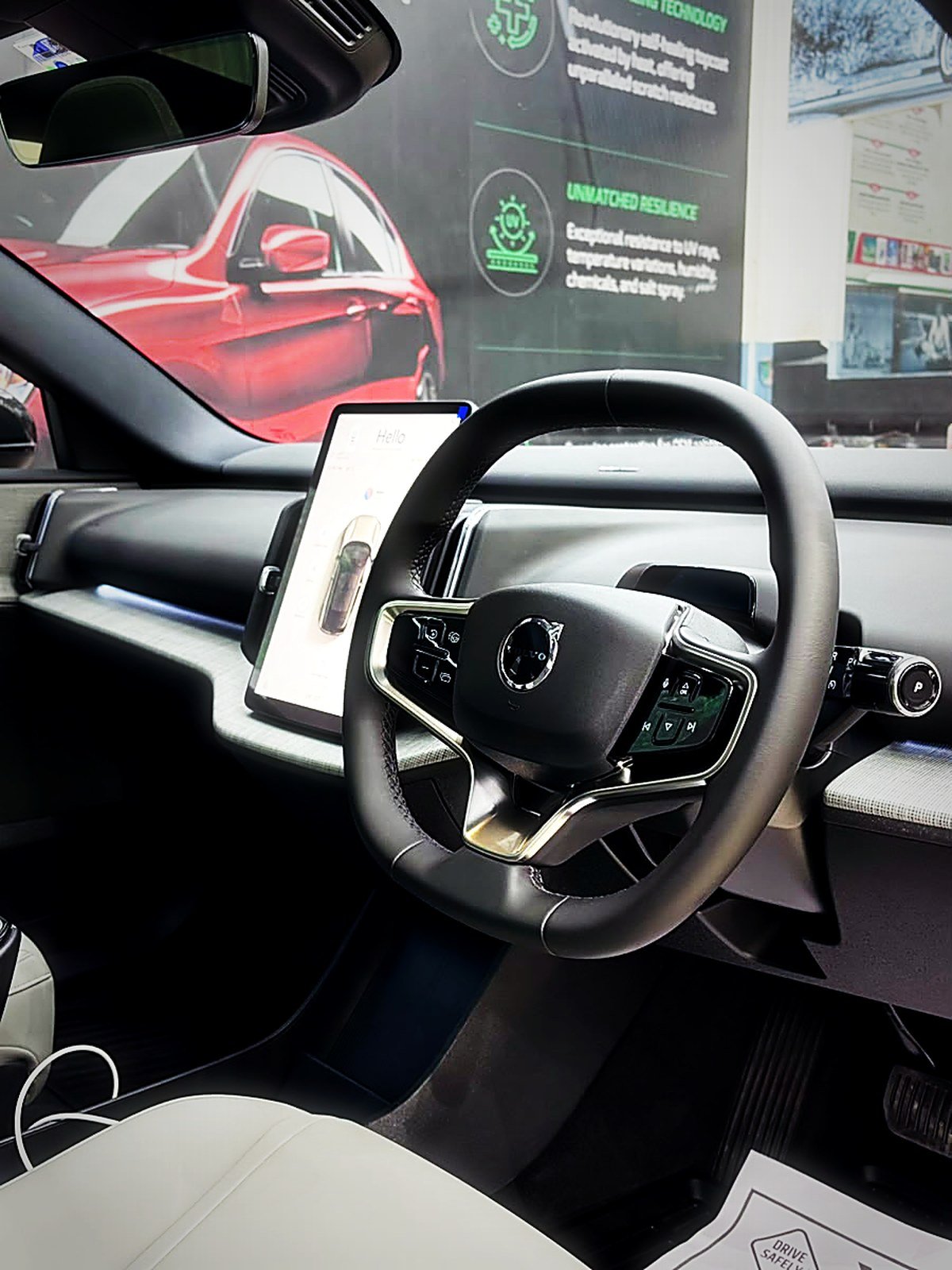 A clean modern car cabin with the steering wheel and centre screen at Turtle Wax Studio Tellapur